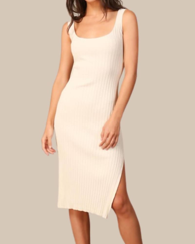 Front of a model wearing a size Large Classic Ribbed Knit Dress In Cream in Cream by line and dot. | dia_product_style_image_id:346527